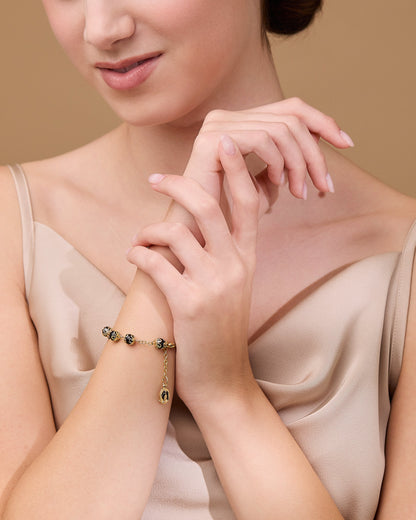 Gold-tone Bracelet with Small Black Crystal Beads and Filigree Bead Caps