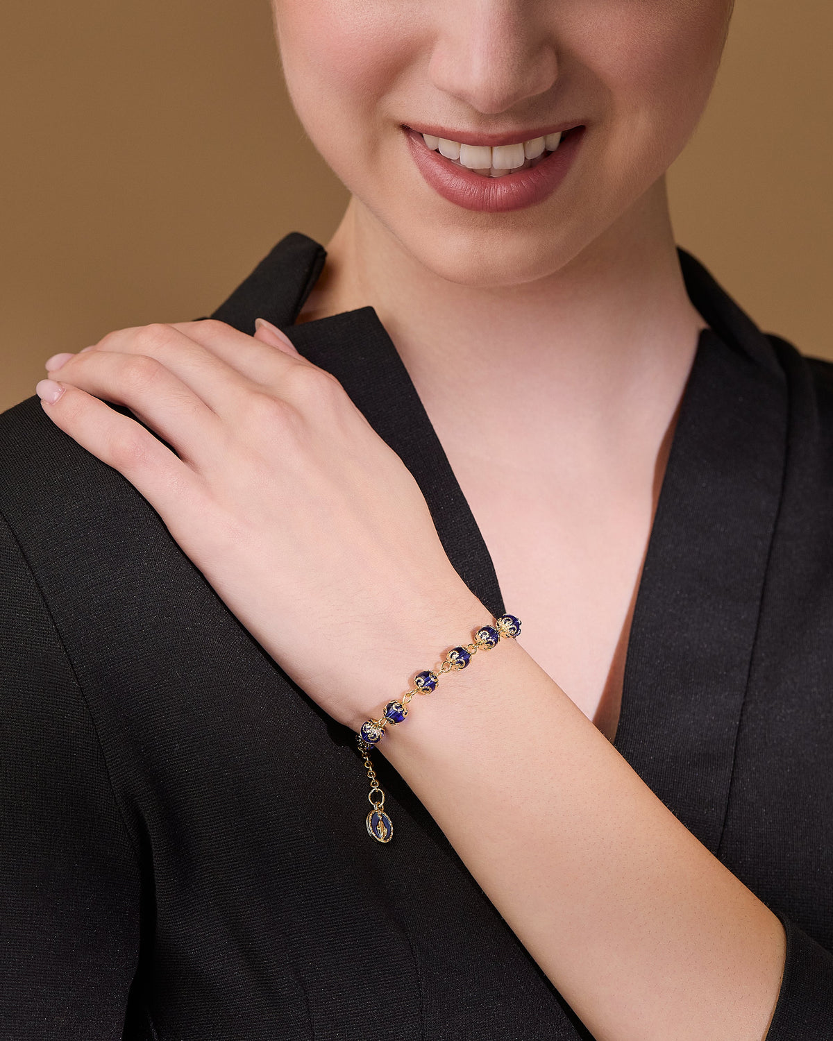 Gold-tone Bracelet with Small Blue Crystal Beads and Filigree Bead Caps