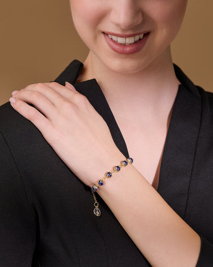 Gold-tone Bracelet with Small Blue Crystal Beads and Filigree Bead Caps