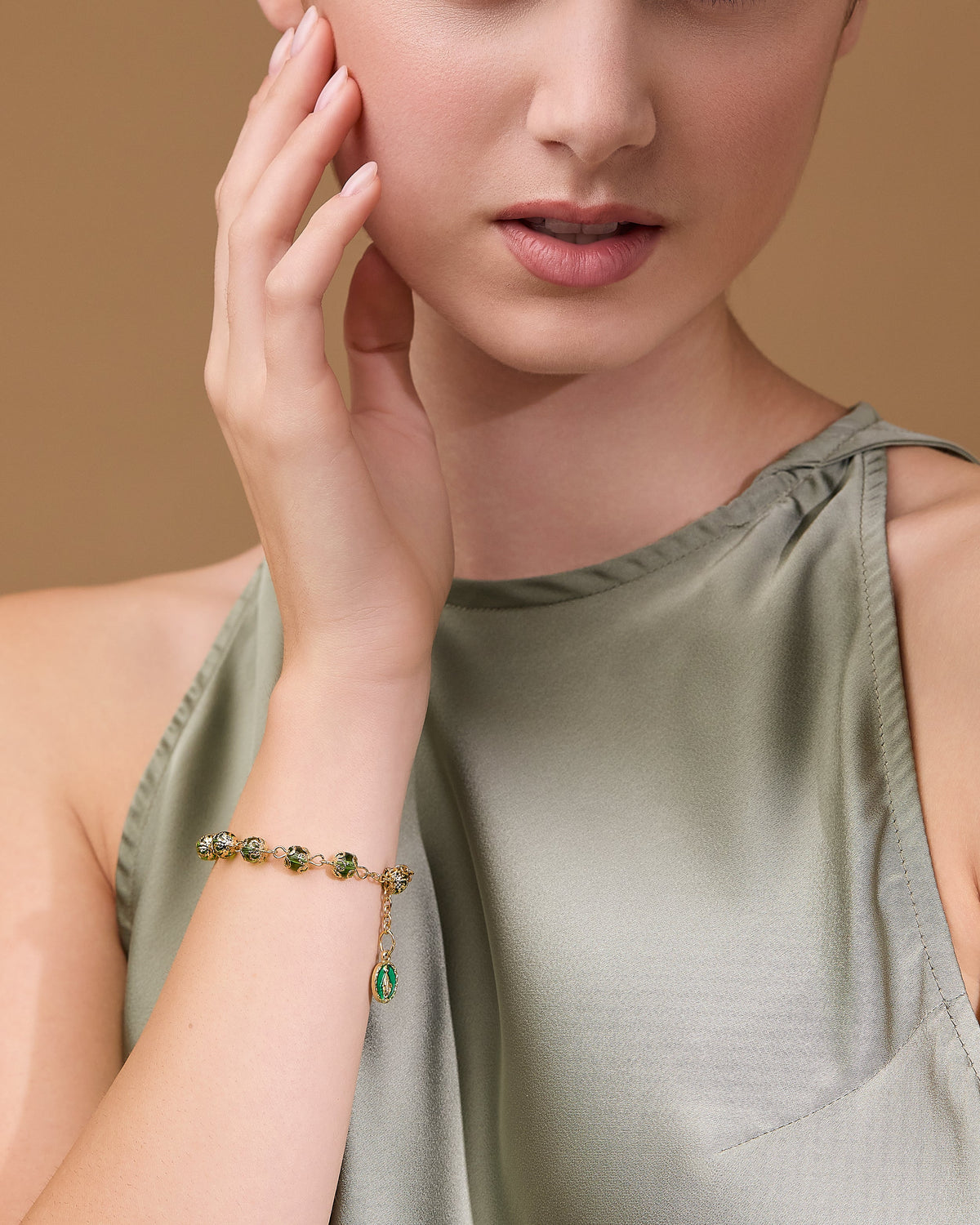 Gold-tone Bracelet with Small Green Crystal Beads and Filigree Bead Caps