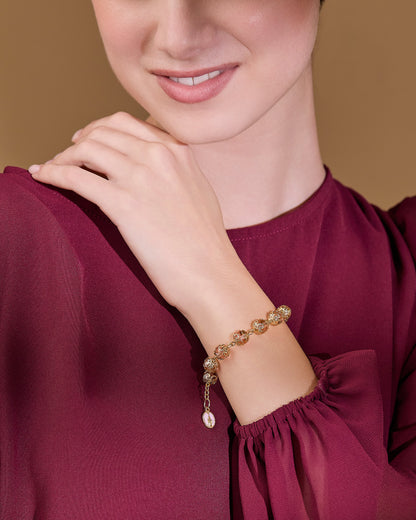 Gold-tone Rosary Bracelet with Pink Crystal Beads and Filigree Bead Caps